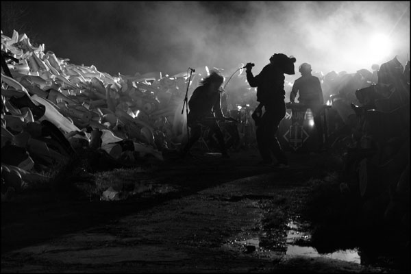 Smoke, shadows and silhouettes. The Undaunted perform surrounded by walls of mannequin parts. Photography by Greig Clifford