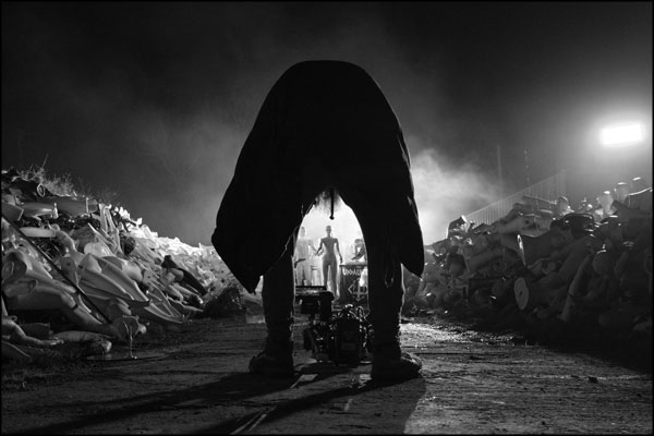Shaun Hodson / Loki Films leans over the camera, lining up the next shot. Photography by Greig Clifford