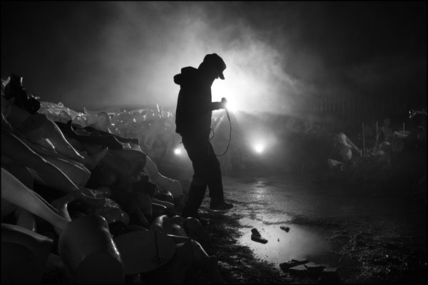 A silhouetted OC Preciado, vocalist with The Undaunted prepares for a take in the smoke and lights on the set of the R.I.P. music video. Photography by Greig Clifford