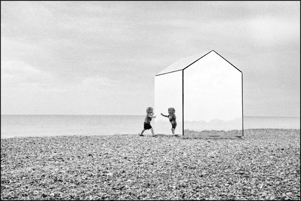 A-027. Child, and a beach hut made of mirrors - by Greig Clifford