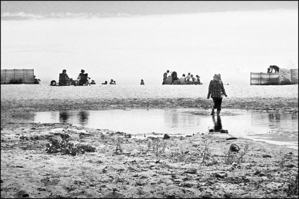 B-027. At the beach, paddling - by Greig Clifford
