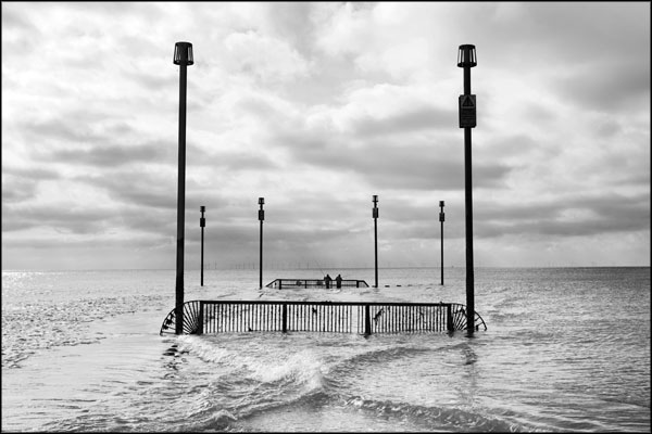 B-068. Fishing at the Southwick outfall, as rain falls upon the wind farm (3) - by Greig Clifford