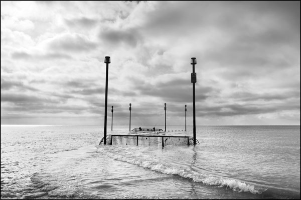 B-069. Fishing at the Southwick outfall, as rain falls upon the wind farm (4) - by Greig Clifford