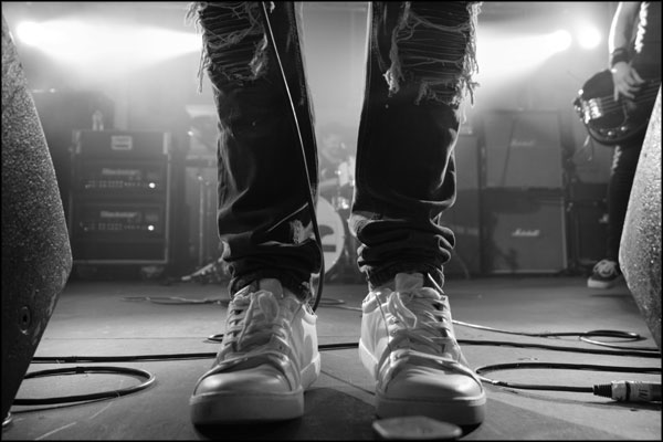 Legs of the frontman from Caine, at Hammerdown Festival, by Greig Clifford