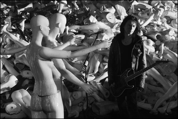 Mannequins reaching out to guitarist Andrew Trewin, during a break in filming for The Undaunted's R.I.P. music video. Photography by Greig Clifford
